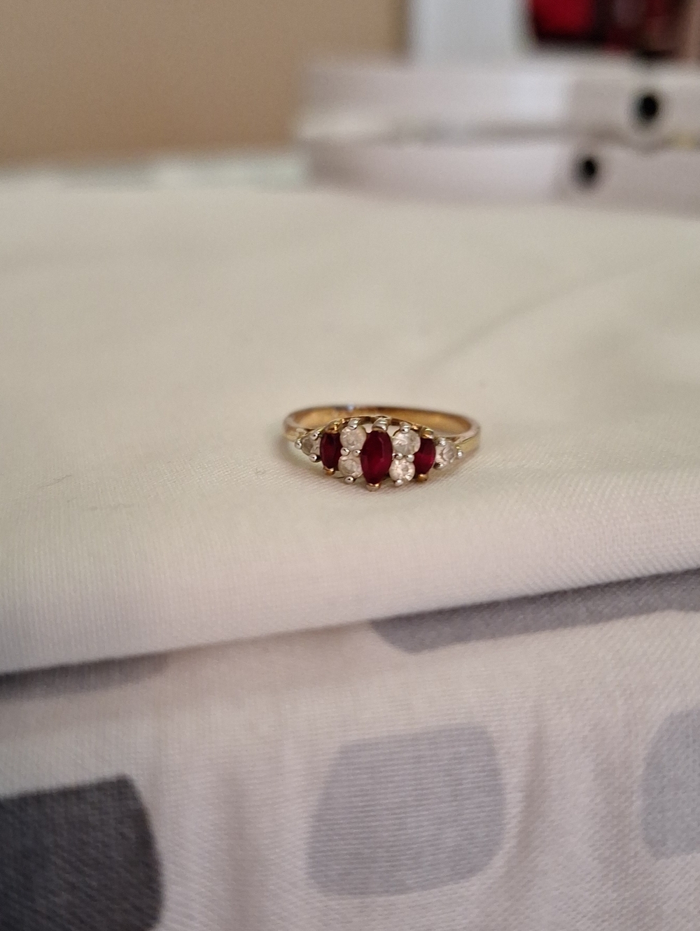 Gold Ring with Red Ruby Stones and Accent Diamonds